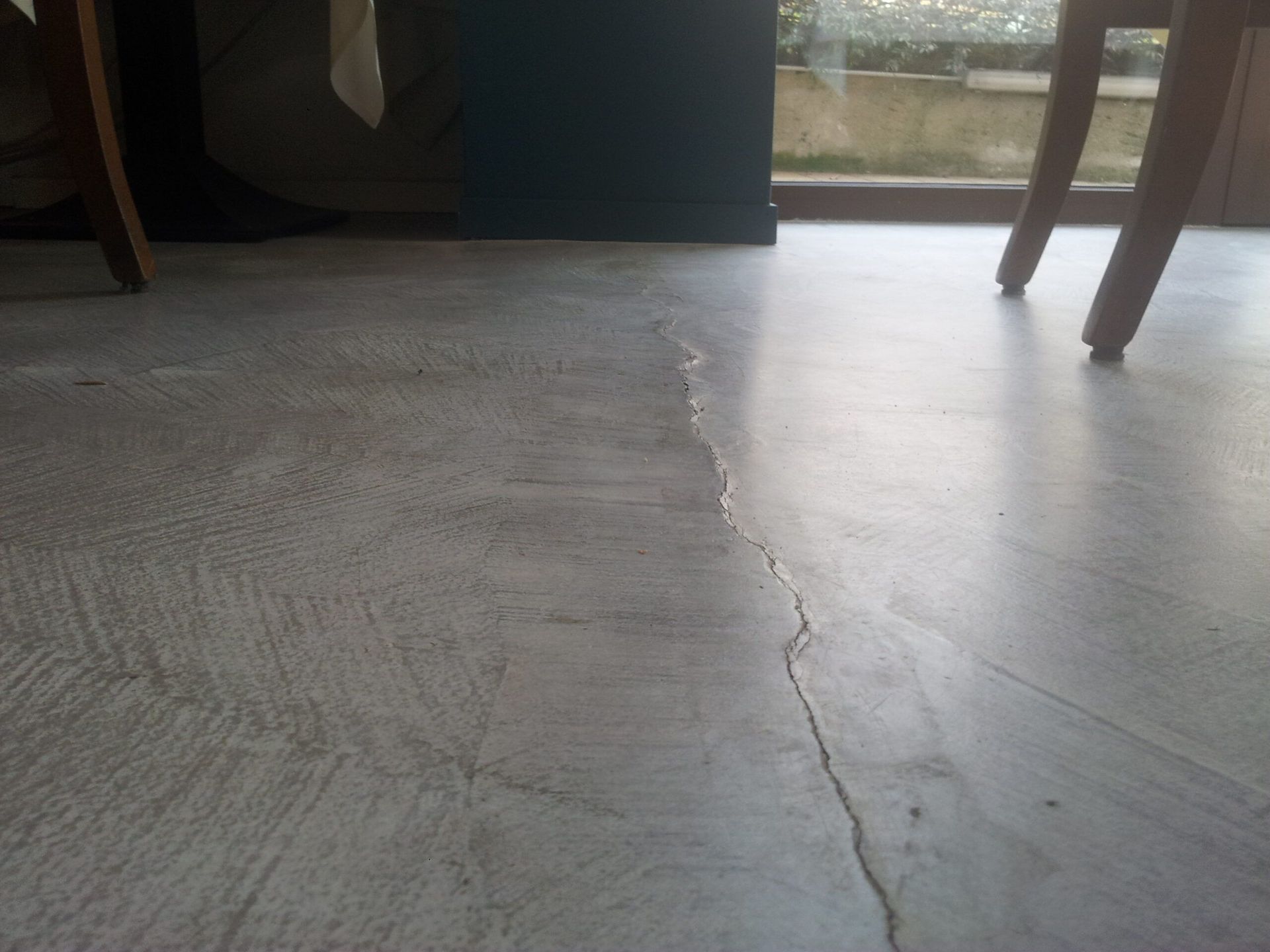 Crack reflected through a finish from the screed below